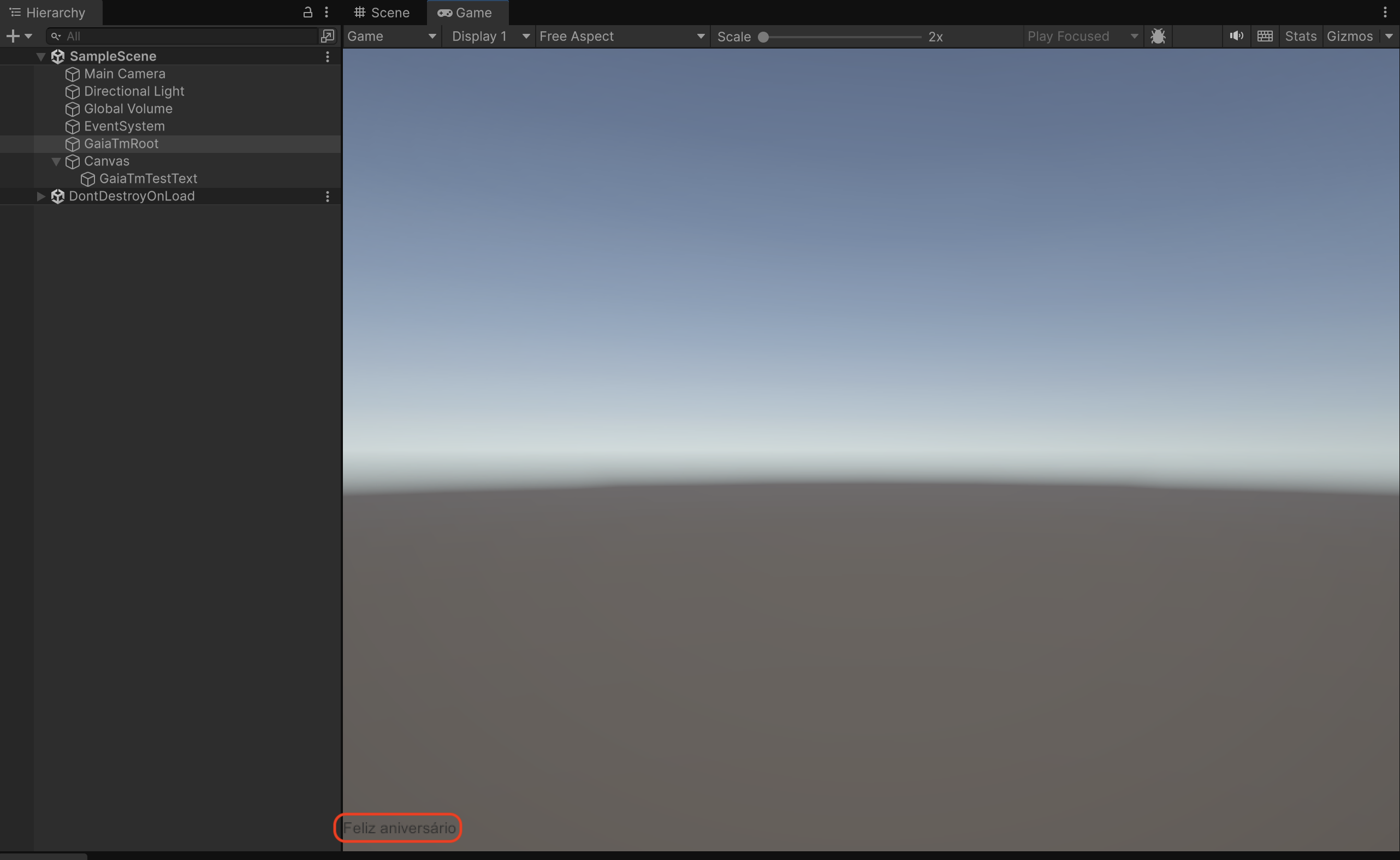 Unity Game view showing GaiaTmTestText updated to Feliz aniversario.
